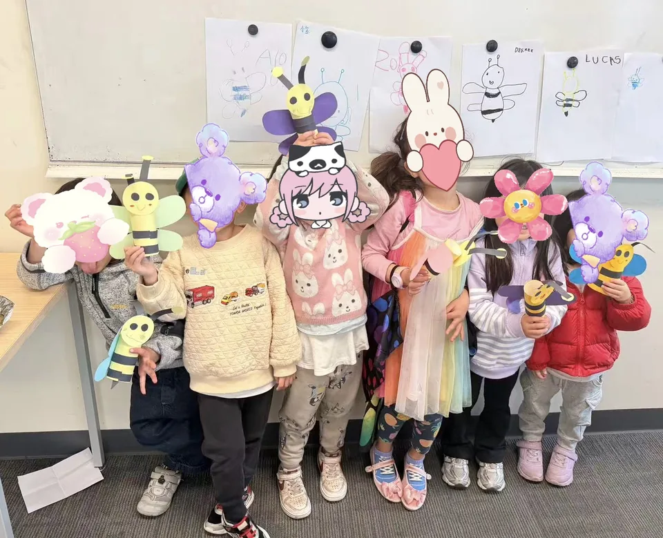 Sharing colourful crafts with classmates